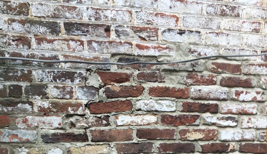 efflorescence on brick foundation