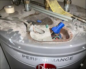 Water heater with exposed and loose wiring